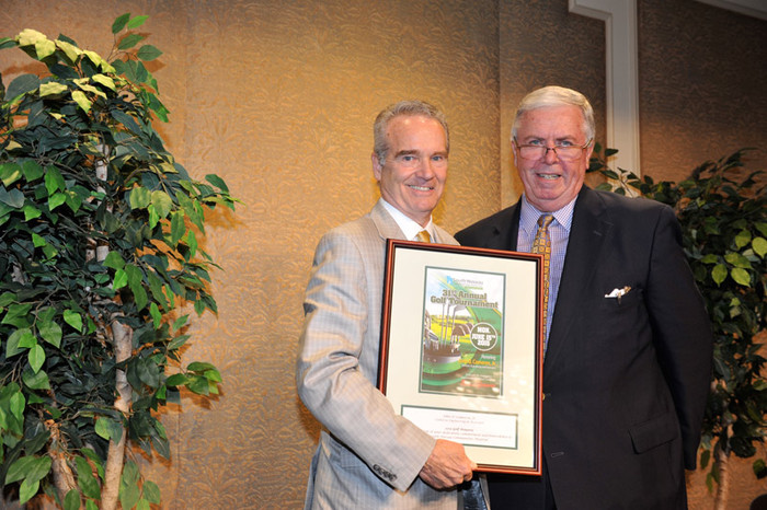 John D. Cameron, Jr., P.E., (left) founder and managing partner of Cameron Engineering in Woodbury, NY, receives the SNCH Annual Golf Outing honoree award from Richard J. Murphy, president and CEO of South Nassau Communities Hospital.